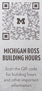 QR codes located outside the buildings at Michigan Ross. Scanning them provides information on building hours